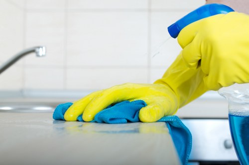 Treating fabric stains with a cleaning solution